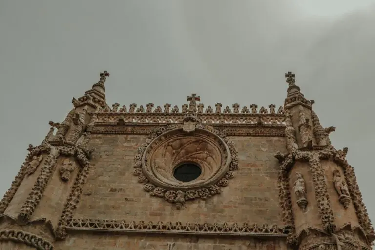 Carved pinnacles and the round window of the Convent of Christ in Tomar