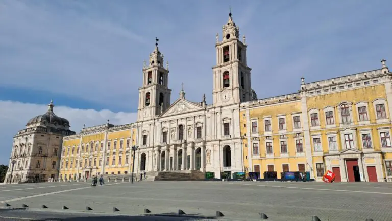 The long baroque facade and twin bell towers of Mafra National Palace