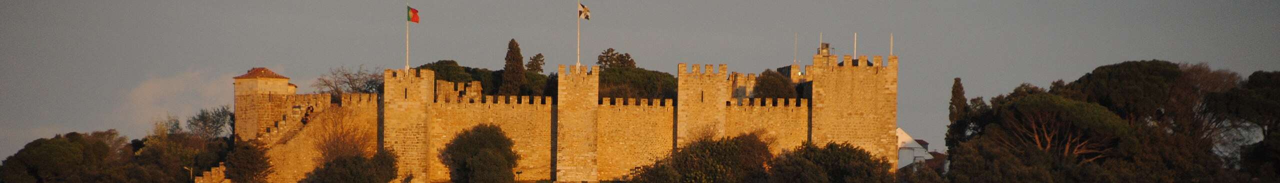 The walls of São Jorge Castle above Lisbon, in evening light